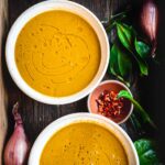 This is a picture of two moringa soup bowls in a serving tray.