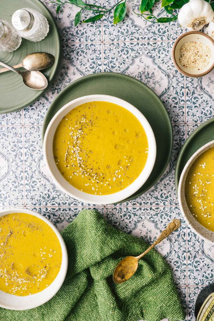 This is top down view of 3 bowls of soup of the instant pot vegetarian okra lentil soup