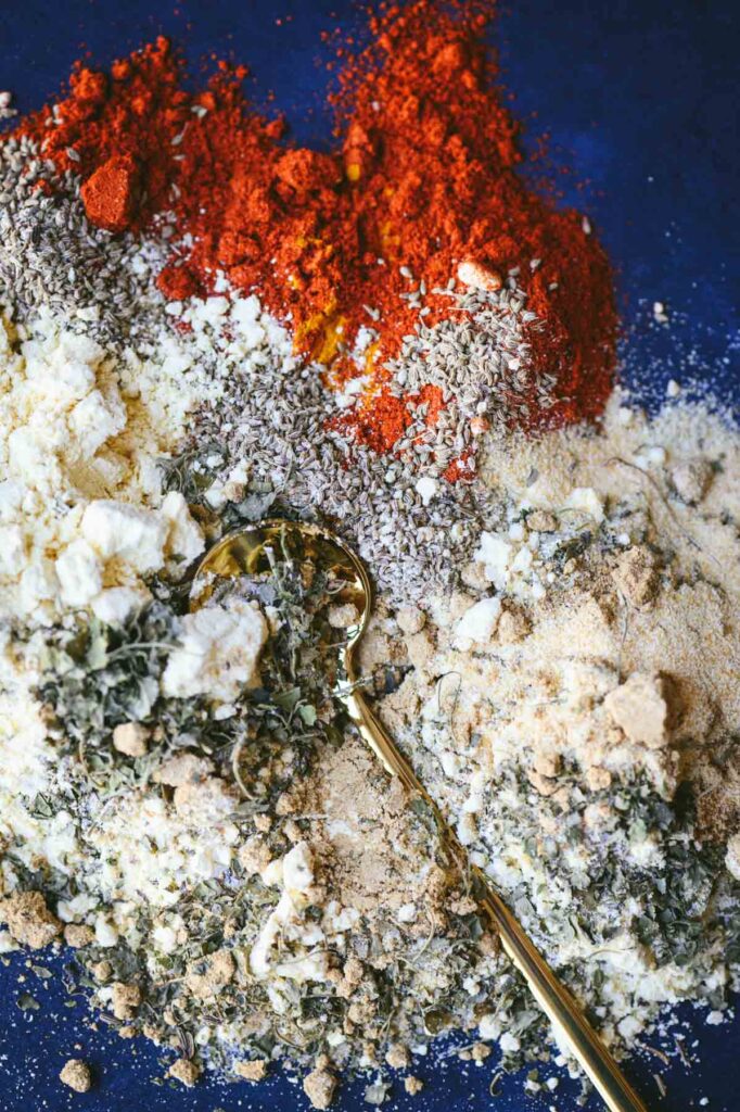 This is a picture of all the ingredients spices and mixes used in the homemade tikka masala seasoning spread on a table