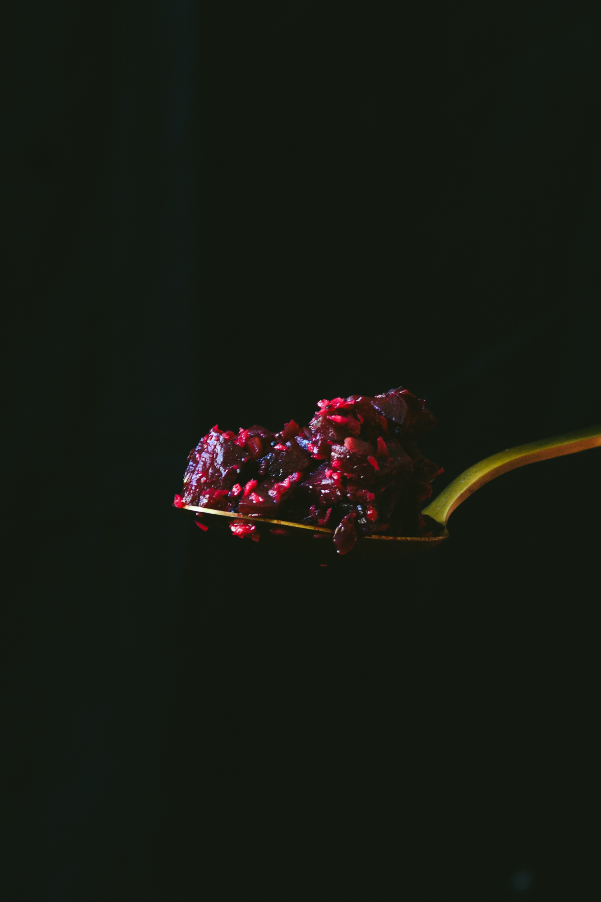 This is a picture of beetroot poriyal on a spoon.