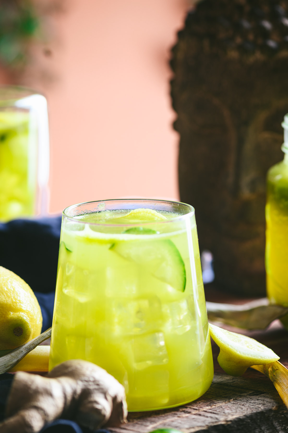 This is a picture of pineapple cucumber ginger detox juice set on a table