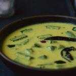 Vendakkai mor kuzhambu served in a blue bowl.