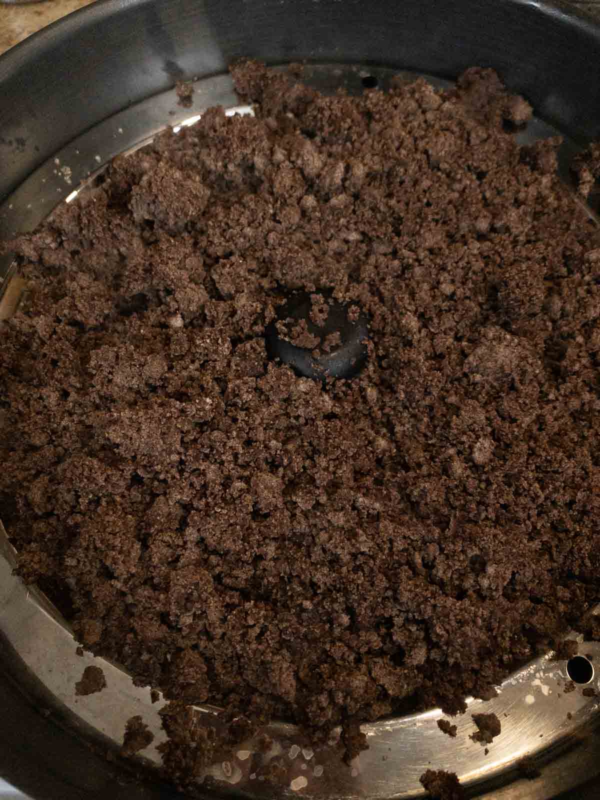 Steaming the ragi flour to make ragi laddu.