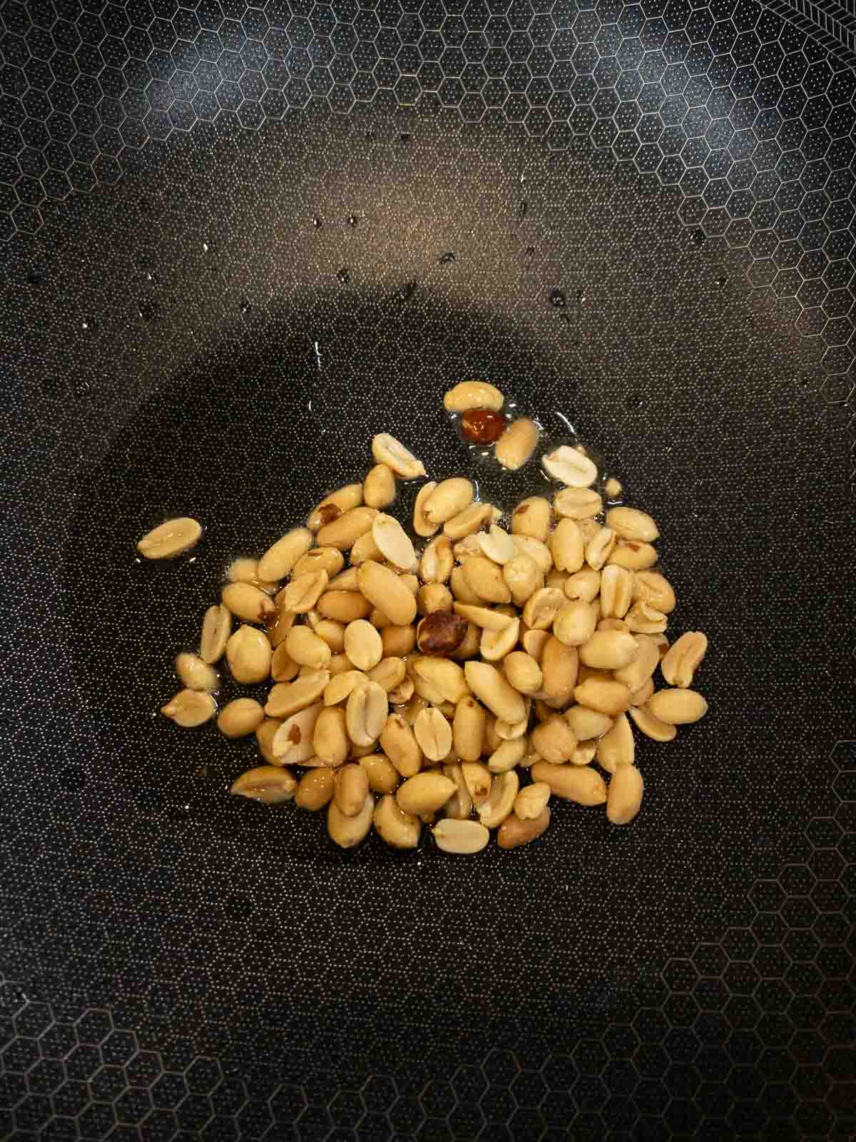 Roasted peanuts on a pan.