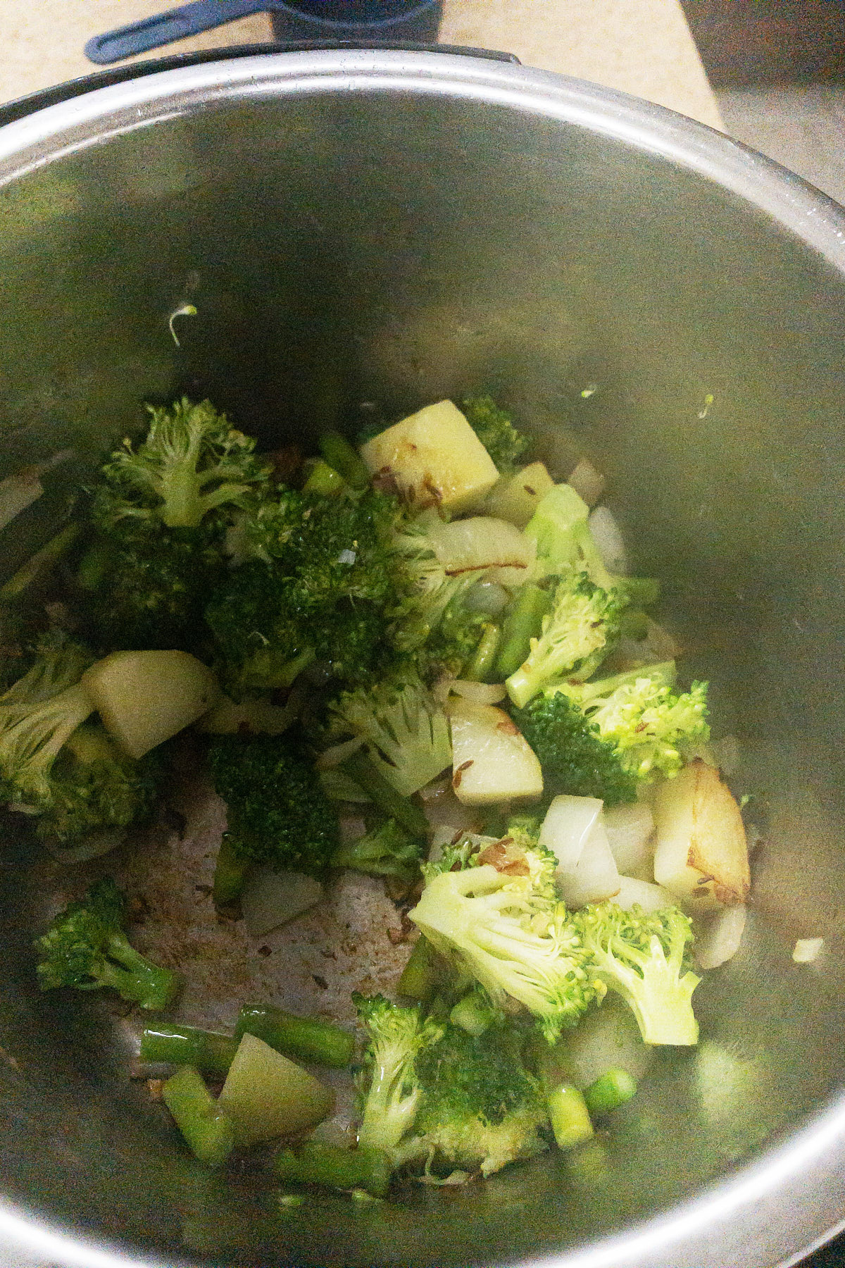 Add in the broccoli florets for almond broccoli asparagus soup.