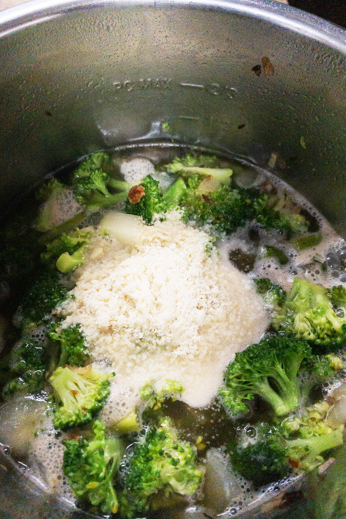 Add water, almond flour to the mixture to make almond broccoli asparagus soup.