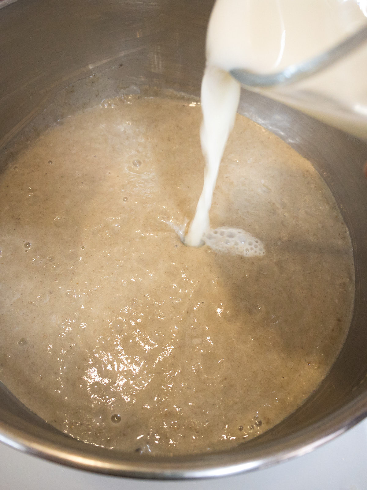 Add in almond milk to the soup puree.