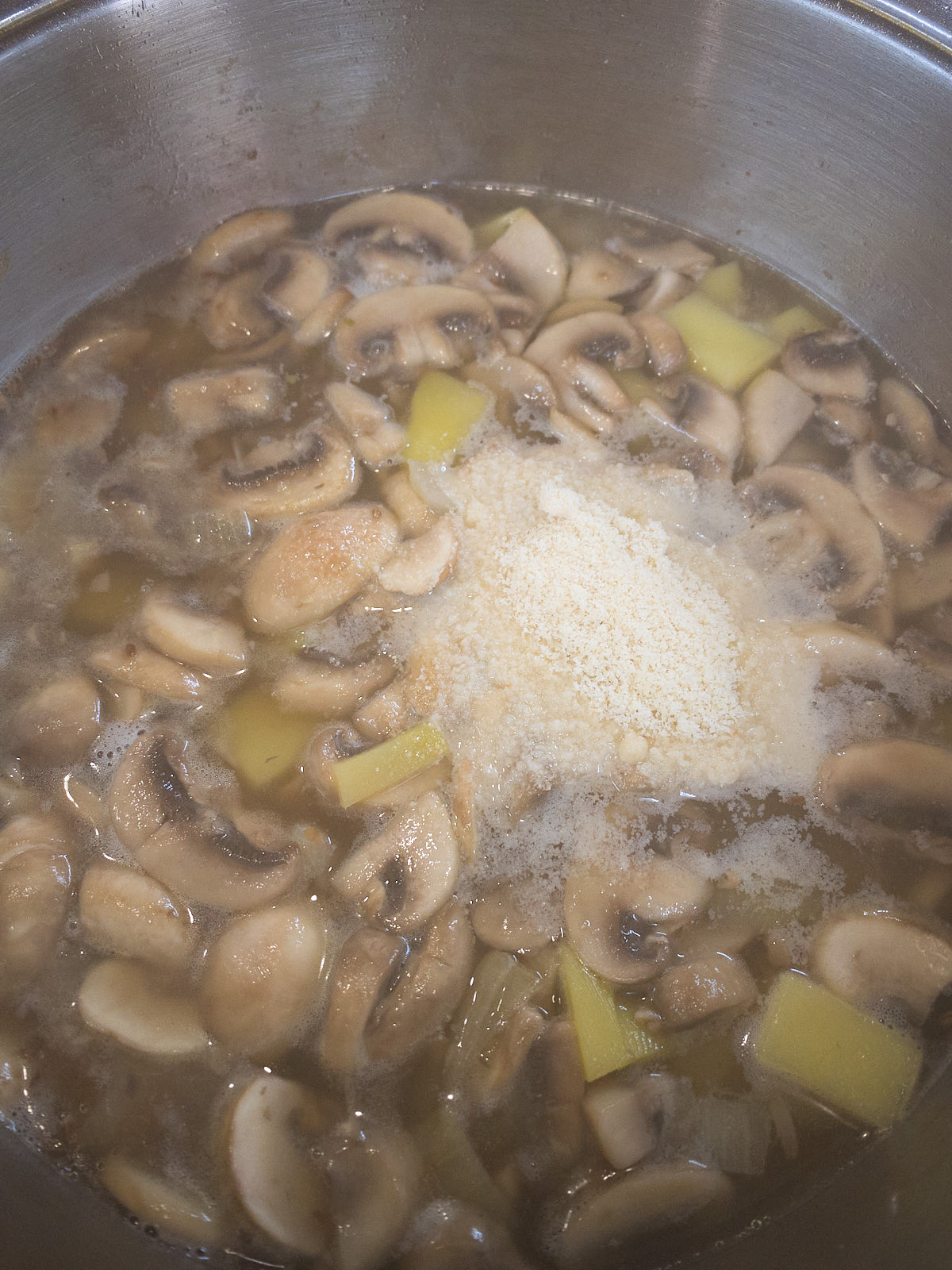 Add water or vegetable broth to the pan.