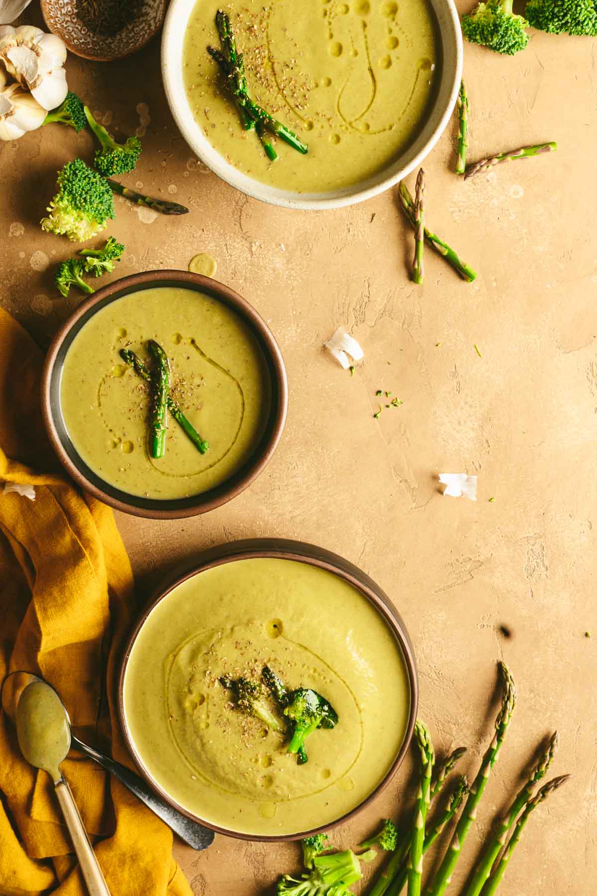 This is a picture of almond broccoli asparagus soup served on a table.