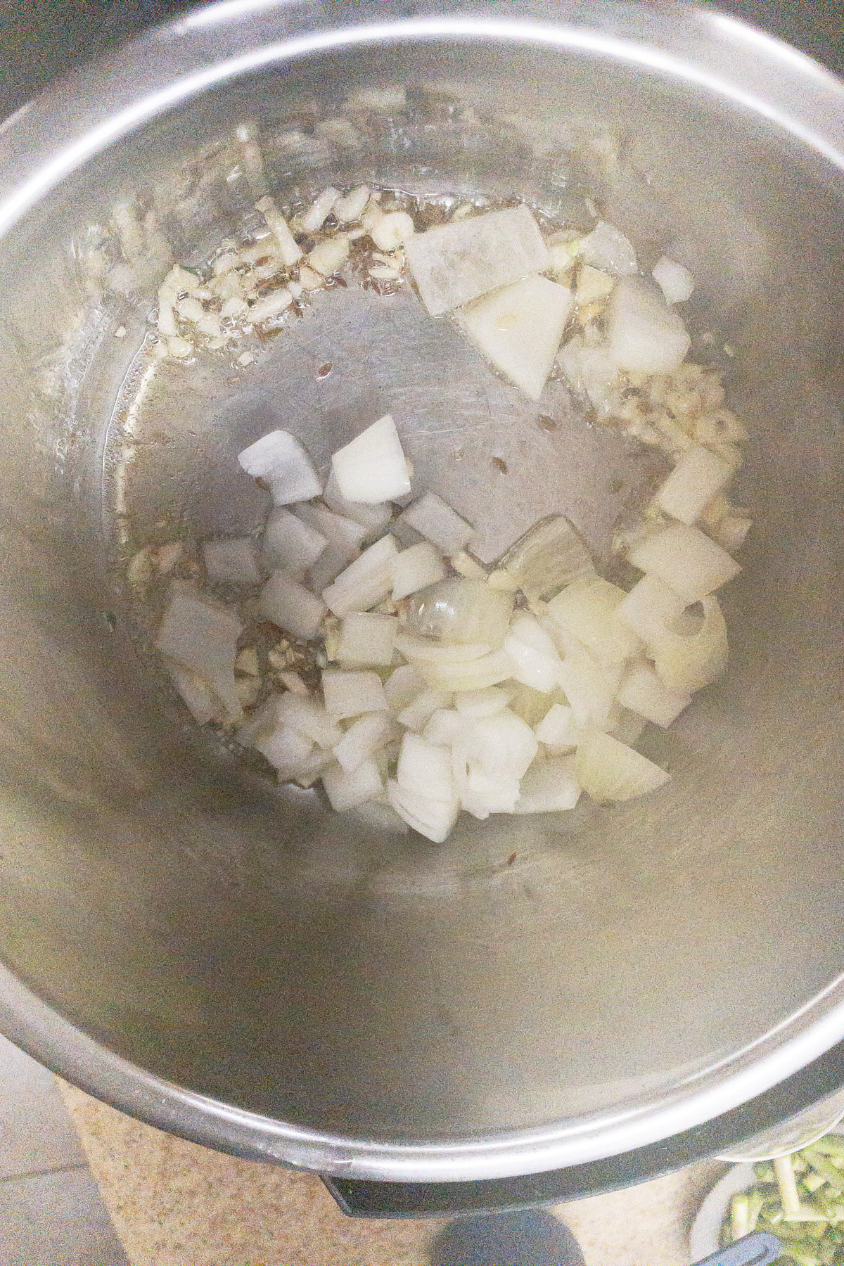 Sauteing onions for almond broccoli asparagus soup.