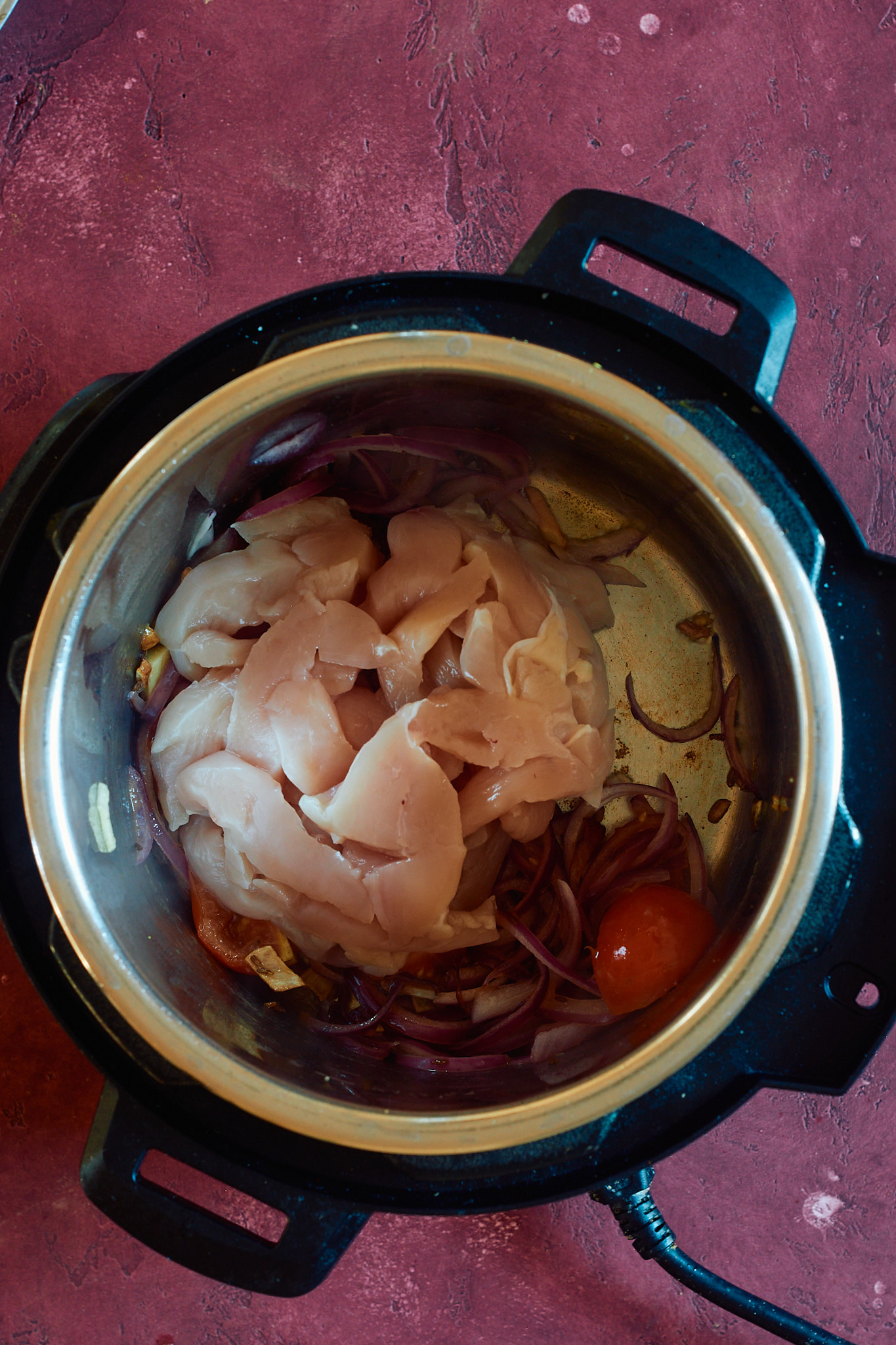 Add the chicken to the instant pot.