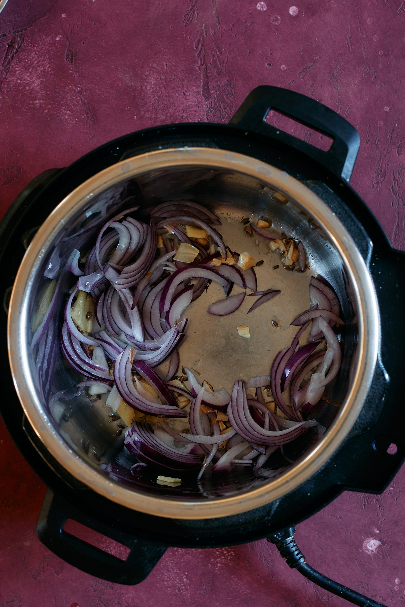 Add onions to the instant pot and saute.